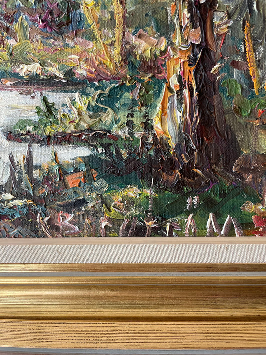 Impasto oil painting of a sunlit woodland stream framed by trees under a pale blue sky, in a gold gilt frame