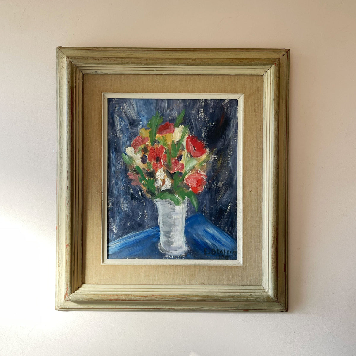 Vintage still life oil painting of red poppies and anemones in a white vase against deep blue