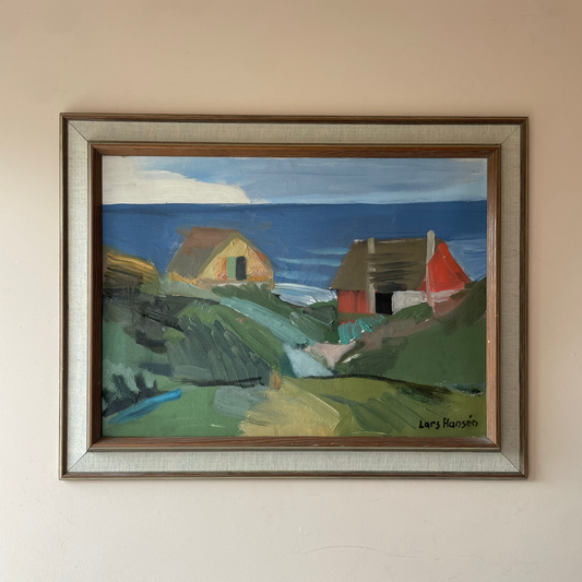Original mid century Scandinavian coastal oil painting signed Lars Hansén. Cottages above a blue sea in a linen slip frame. Free UK delivery.