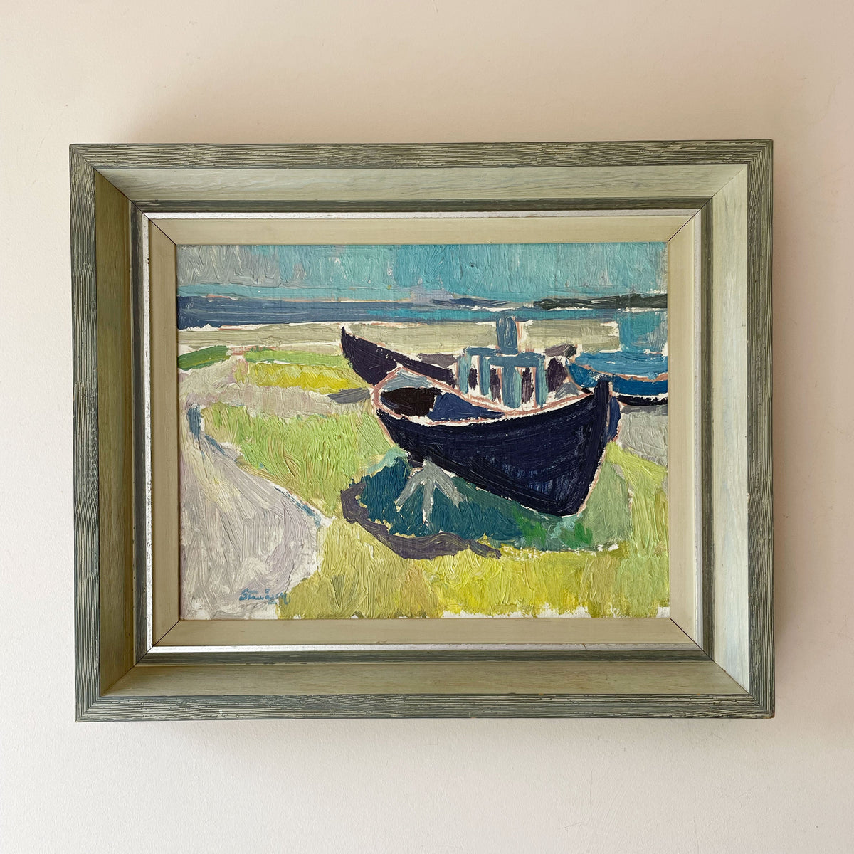 Vintage Swedish oil painting of two fishing boats hauled onto grass above turquoise sea, in wooden frame