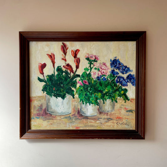 Vintage oil painting of three white pots of red, pink and cobalt flowers on ochre tabletop, by Celiz, in dark wooden frame