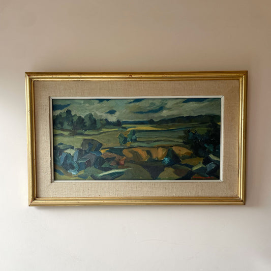 Original mid century Scandinavian oil painting of fields and boulders under a moody sky, in a linen and gilt frame. One-of-a-kind. Free UK delivery.