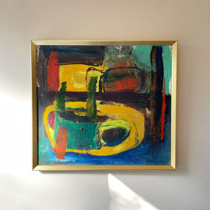 Vibrant mid-century abstract oil painting, dated 1972, in bold blocks of yellow, green, cobalt blue and red with thick impasto brushwork, in a gold frame.