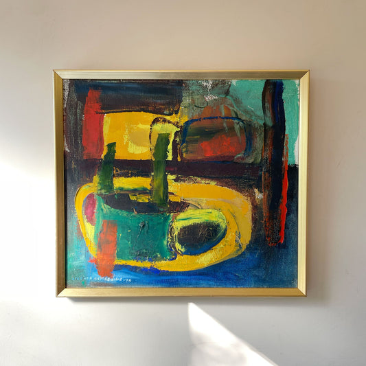 Vibrant mid-century abstract oil painting, dated 1972, in bold blocks of yellow, green, cobalt blue and red with thick impasto brushwork, in a gold frame.