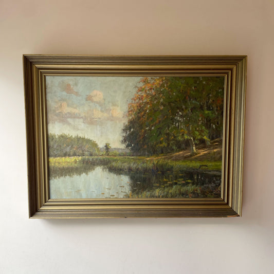 Original vintage impressionist oil painting of an autumn river landscape with golden trees and lily pads, in a gold gilt frame. Free UK delivery.