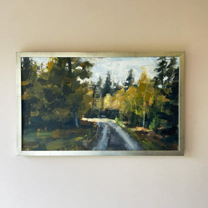 A vintage mid-century landscape oil painting of a road winding through dense woodland, in deep greens, ochre and grey.